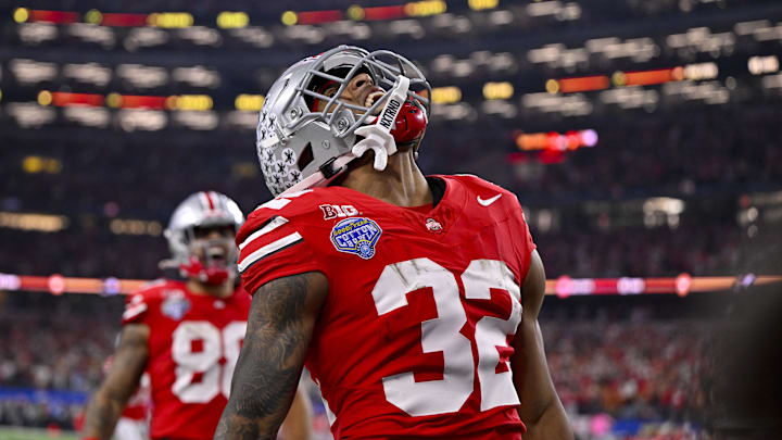 Jan 10, 2025; Arlington, TX, USA;  Ohio State Buckeyes running back TreVeyon Henderson (32) scores a touchdown on a pass from quarterback Will Howard (not pictured) during the second quarter at AT&T Stadium. Mandatory Credit: Jerome Miron-Imagn Images