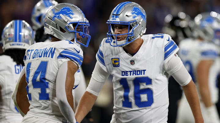 Sep 22, 2025; Baltimore, Maryland, USA; Detroit Lions quarterback Jared Goff (16) reacts with wide receiver Amon-Ra St. Brown (14) during the first half against the Baltimore Ravens at M&T Bank Stadium. Mandatory Credit: Peter Casey-Imagn Images