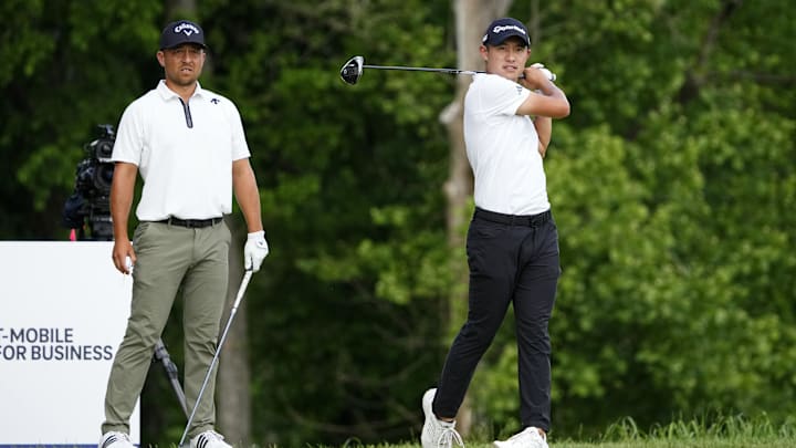 May 18, 2024; Louisville, Kentucky, USA; Xander Schauffele watches as Collin Morikawa tees off on