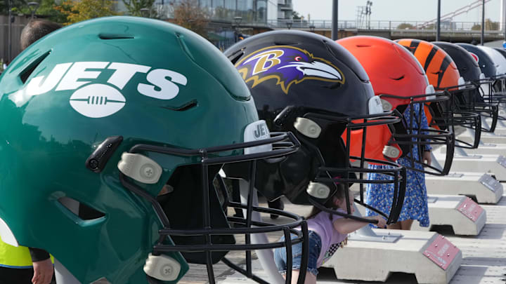Oct 7, 2023; London, United Kingdom; Large oversized helmets of the New York Jets Baltimore Ravens, Cleveland Browns and Cincinnati Bengals at the NFL Experience London at the Battersea Power Station. Mandatory Credit: Kirby Lee-Imagn Images