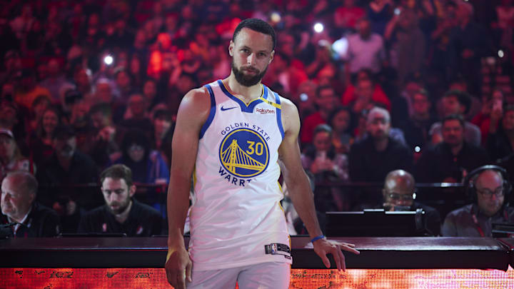 Apr 11, 2025; Portland, Oregon, USA; Golden State Warriors guard Stephen Curry (30) watches during introductions before a game against the Portland Trail Blazers at Moda Center. Mandatory Credit: Troy Wayrynen-Imagn Images