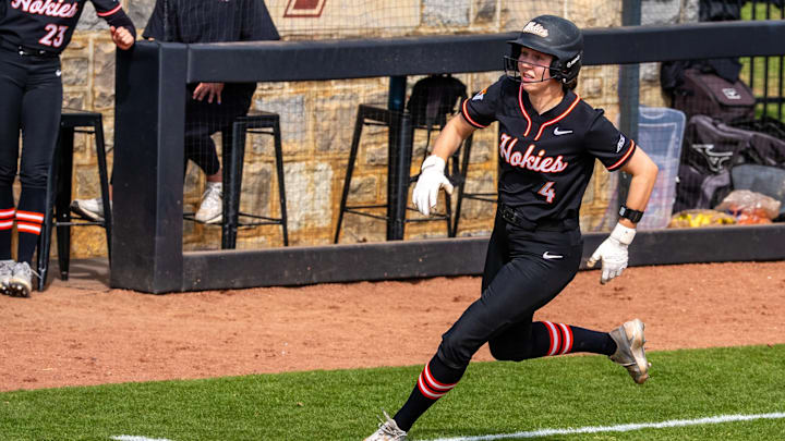 Michelle Chatfield (4) rounds third in a sprint home. Michelle Chatfield (4) rounds third in a sprint home.