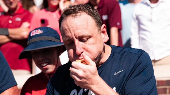 Joey Chestnut participates in the hot dog eating competition at the Grove Bowl Games on Saturday.