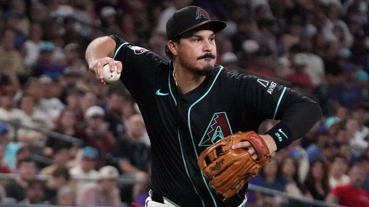 Sep 12, 2026; Phoenix, Arizona, USA;  Arizona Diamondbacks third baseman Nolan Arenado (28) makes the throw against the Texas Rangers in the fifth inning at Chase Field.  Mandatory Credit: Rick Scuteri-Imagn Images