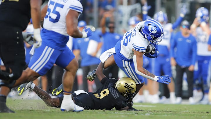 Oct 26, 2024; Orlando, Florida, USA;  Brigham Young Cougars linebacker Isaiah Glasker (16) intercepts a pass against Central Florida Knights wide receiver Ja'Varrius Johnson (9) in the second half at FBC Mortgage Stadium. Mandatory Credit: Russell Lansford-Imagn Images