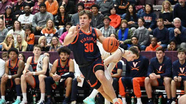 Dec 31, 2025; Blacksburg, Virginia, USA; Virginia Cavaliers guard Dallin Hall (30) drives the base line during the second overtime period at Cassell Coliseum. Mandatory Credit: Brian Bishop-Imagn Images