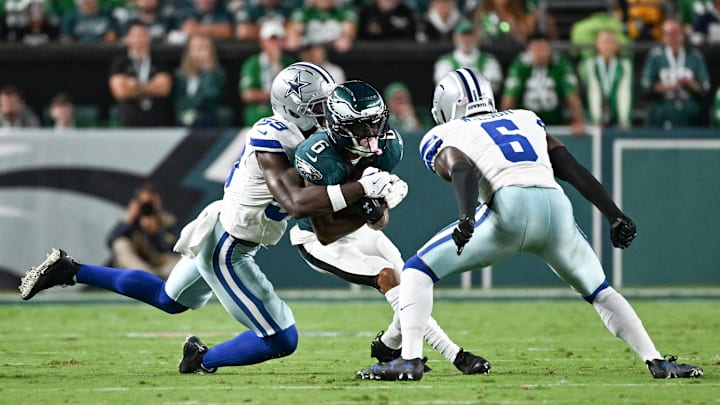 Eagles wide receiver DeVonta Smith is tackled by Dallas Cowboys linebacker Kenneth Murray Jr. and safety Donovan Wilson. Eagles wide receiver DeVonta Smith is tackled by Dallas Cowboys linebacker Kenneth Murray Jr. and safety Donovan Wilson.