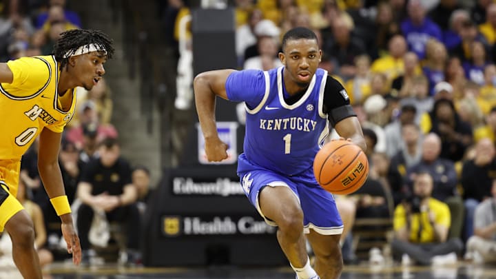 Mar 8, 2025; Columbia, Missouri, USA; Kentucky Wildcats guard Lamont Butler (1) dribbles past Missouri Tigers guard Anthony Robinson II (0) in the second half at Mizzou Arena. Mandatory Credit: Gary Rohman-Imagn Images