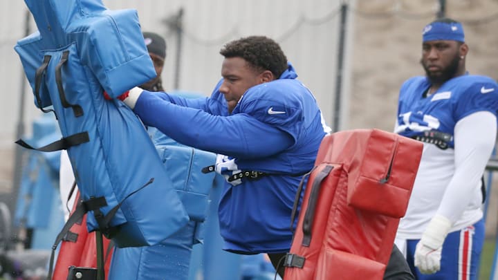 Bills defensive tackle Deone Walker hits the blocking sled during position drills during day seven of Buffalo Bills training camp at St. John Fisher University Thursday, July 31, 2025 in Pittsford, NY.