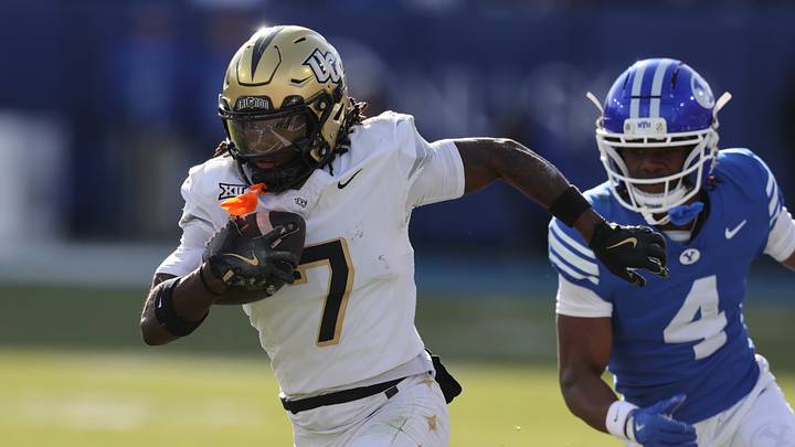 Nov 29, 2025; Provo, Utah, USA; UCF Knights wide receiver Duane Thomas Jr. (7) runs after a catch against BYU Cougars cornerback Mory Bamba (4) during the first quarter at LaVell Edwards Stadium. Mandatory Credit: Rob Gray-Imagn Images Nov 29, 2025; Provo, Utah, USA; UCF Knights wide receiver Duane Thomas Jr. (7) runs after a catch against BYU Cougars cornerback Mory Bamba (4) during the first quarter at LaVell Edwards Stadium. Mandatory Credit: Rob Gray-Imagn Images