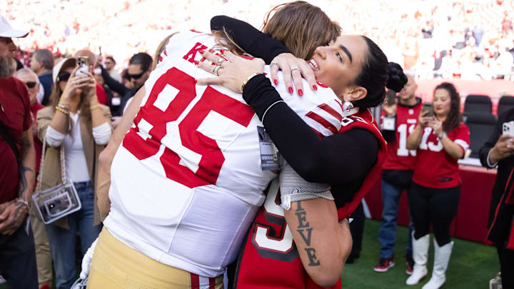 Jan 5, 2025; Glendale, Arizona, USA; San Francisco 49ers tight end George Kittle (85) hugs wife Claire Kittle prior to the game against the Arizona Cardinals at State Farm Stadium.