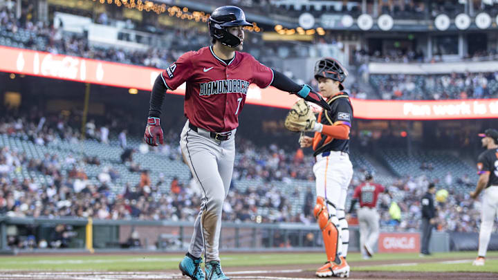 May 13, 2025; San Francisco, California, USA; Arizona Diamondbacks right fielder Corbin Carroll (7) scores a run against the San Francisco Giants during the first inning at Oracle Park. Mandatory Credit: John Hefti-Imagn Images