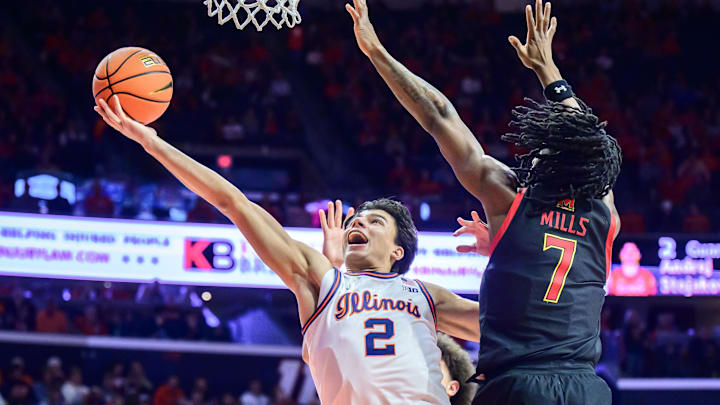 Jan 21, 2026; Champaign, Illinois, USA; Illinois Fighting Illini guard Andrej Stojakovic (2) drives for a basket against Maryland Terrapins guard Andre Mills (7) during the second half at State Farm Center. Mandatory Credit: Fred Zwicky-Imagn Images