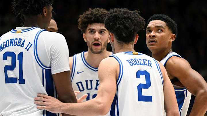 Jan 10, 2026; Durham, North Carolina, USA; Duke Blue Devils players (left to right) Pat Ngongba II, Cameron Boozer, Cayden Boozer, and Caleb Foster huddle during the second half against the Southern Methodist Mustangs at Cameron Indoor Stadium. Mandatory Credit: Rob Kinnan-Imagn Images