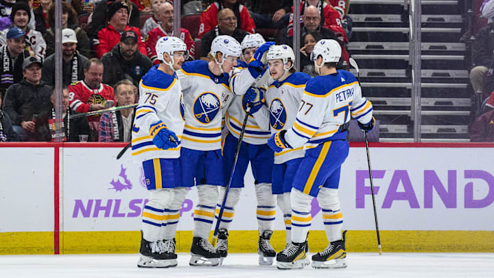 Nov 19, 2023; Chicago, Illinois, USA; Buffalo Sabres defenseman Rasmus Dahlin (26) celebrates his goal with teammates against the Chicago Blackhawks during the first period at the United Center. Mandatory Credit: Daniel Bartel-Imagn Images