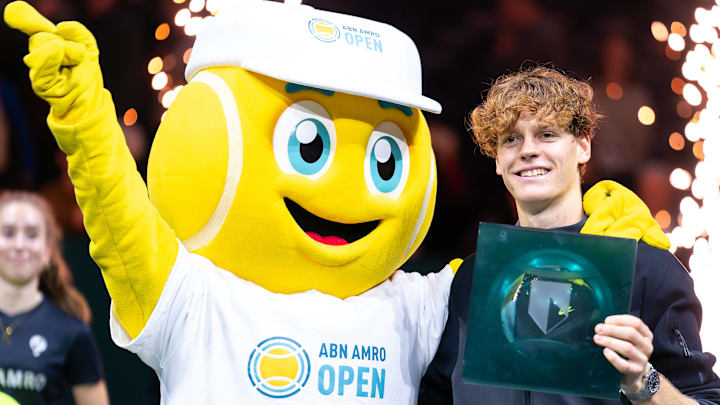 Jannik Sinner is seen posing with his trophy and the mascot after winning the tournament during Day 7 of the ABN AMRO Open 2024 at Ahoy on February 18, 2024 in Rotterdam, Netherlands. Jannik Sinner is seen posing with his trophy and the mascot after winning the tournament during Day 7 of the ABN AMRO Open 2024 at Ahoy on February 18, 2024 in Rotterdam, Netherlands.