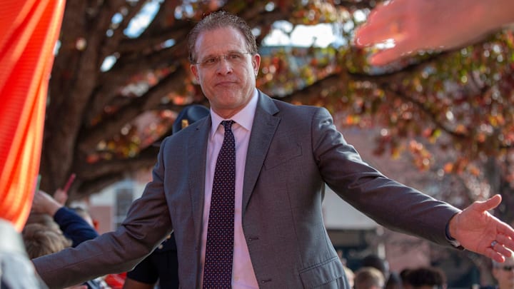 Auburn head coach Gus Malzahn slaps hands with fans as he   s led down a narrow pathway to the stadium during Tiger Walk.

Iron Bowl 2019