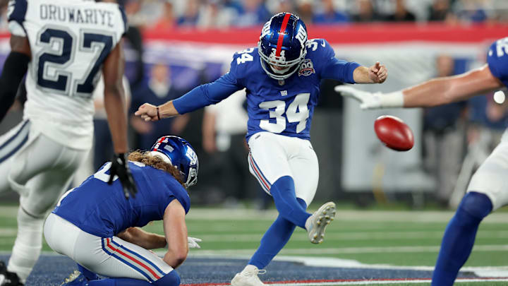 Sep 26, 2024; East Rutherford, New Jersey, USA; New York Giants place kicker Greg Joseph (34) kicks a field goal with punter Jamie Gillan (6) holding during the first quarter against the Dallas Cowboys at MetLife Stadium. Sep 26, 2024; East Rutherford, New Jersey, USA; New York Giants place kicker Greg Joseph (34) kicks a field goal with punter Jamie Gillan (6) holding during the first quarter against the Dallas Cowboys at MetLife Stadium.