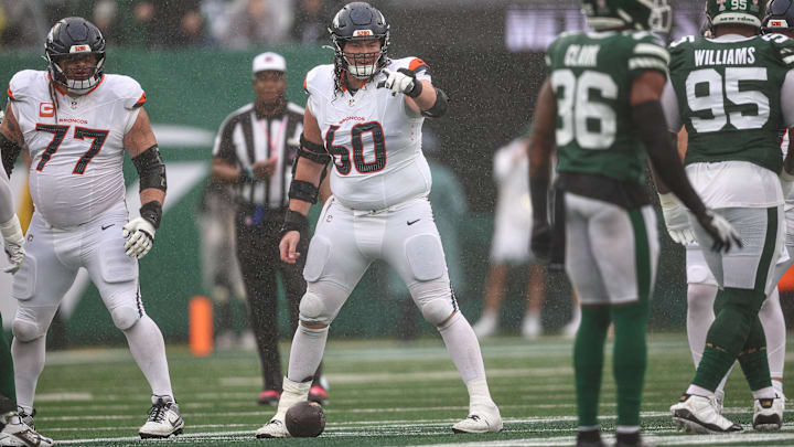 Sep 29, 2024; East Rutherford, New Jersey, USA; Denver Broncos center Luke Wattenberg (60) points during the first half against the New York Jets at MetLife Stadium. Mandatory Credit: Vincent Carchietta-Imagn Images Sep 29, 2024; East Rutherford, New Jersey, USA; Denver Broncos center Luke Wattenberg (60) points during the first half against the New York Jets at MetLife Stadium. Mandatory Credit: Vincent Carchietta-Imagn Images