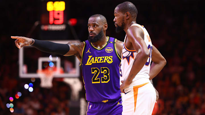 Oct 28, 2024; Phoenix, Arizona, USA; Los Angeles Lakers forward LeBron James (23) against Phoenix Suns forward Kevin Durant (35) at Footprint Center. Mandatory Credit: Mark J. Rebilas-Imagn Images