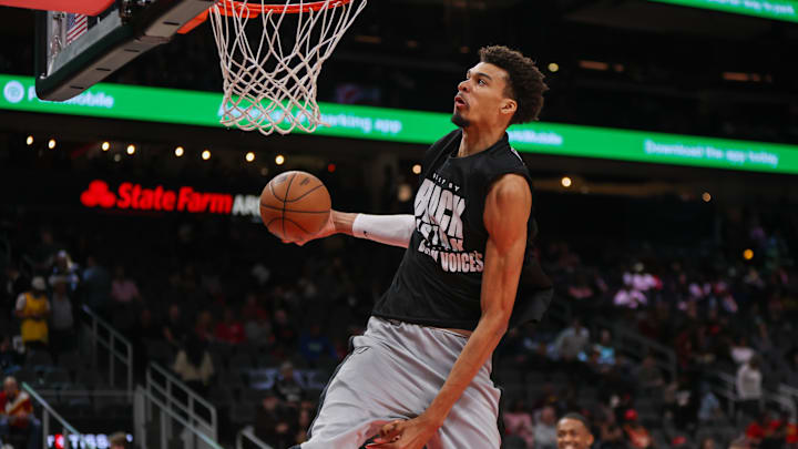 Feb 5, 2025; Atlanta, Georgia, USA; San Antonio Spurs center Victor Wembanyama (1) dunks before a game against the Atlanta Hawks at State Farm Arena.