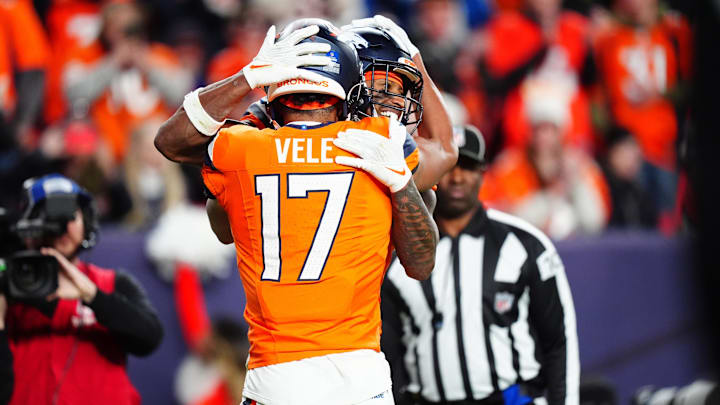 Dec 15, 2024; Denver, Colorado, USA; Denver Broncos wide receiver Courtland Sutton (14) celebrates his touchdown reception with wide receiver Devaughn Vele (17) in the fourth quarter against the Indianapolis Colts at Empower Field at Mile High. Mandatory Credit: Ron Chenoy-Imagn Images Dec 15, 2024; Denver, Colorado, USA; Denver Broncos wide receiver Courtland Sutton (14) celebrates his touchdown reception with wide receiver Devaughn Vele (17) in the fourth quarter against the Indianapolis Colts at Empower Field at Mile High. Mandatory Credit: Ron Chenoy-Imagn Images
