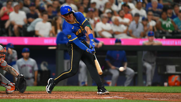 Seattle Mariners infielder Dylan Moore hits a single during a game against the New York Mets on Aug. 9 at T-Mobile Park.