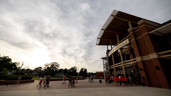 Jun 2, 2024; Stillwater, OK, USA; Oklahoma State and Florida enter the stadium before a late start at a NCAA regional baseball game at O'Brate Stadium. Mandatory Credit: Mitch Alcala-The Oklahoman