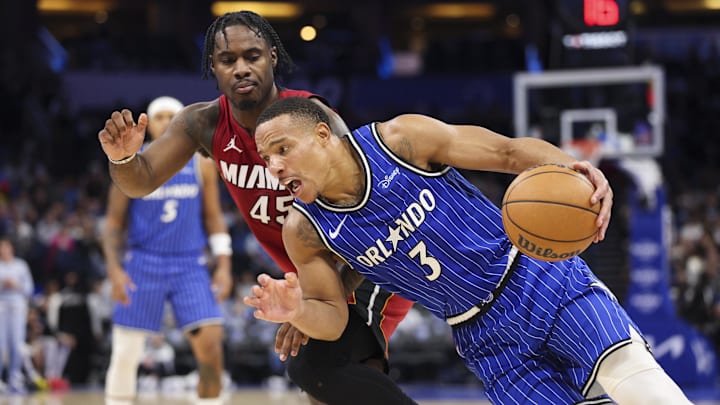 Dec 5, 2025; Orlando, Florida, USA; Orlando Magic guard Desmond Bane (3) drives to the basket past Miami Heat guard Davion Mitchell (45) in the third quarter at Kia Center. Mandatory Credit: Nathan Ray Seebeck-Imagn Images Dec 5, 2025; Orlando, Florida, USA; Orlando Magic guard Desmond Bane (3) drives to the basket past Miami Heat guard Davion Mitchell (45) in the third quarter at Kia Center. Mandatory Credit: Nathan Ray Seebeck-Imagn Images
