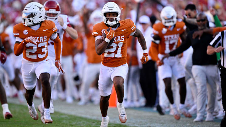 Oct 11, 2025; Dallas, Texas, USA; Texas Longhorns wide receiver Ryan Niblett (21) returns a punt for touchdown against the Oklahoma Sooners during the second half at the Cotton Bowl. Mandatory Credit: Jerome Miron-Imagn Images