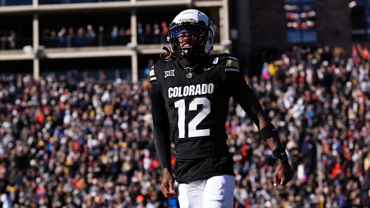 Nov 29, 2024; Boulder, Colorado, USA; Colorado Buffaloes wide receiver Travis Hunter (12) reacts in the first quarter against the Oklahoma State Cowboys at Folsom Field. Mandatory Credit: Ron Chenoy-Imagn Images