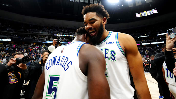 Former Minnesota Timberwolves center Karl-Anthony Towns and guard Anthony Edwards embrace after defeating the Denver Nuggets in game seven of the second round of the 2024 NBA playoffs at Ball Arena in May. 