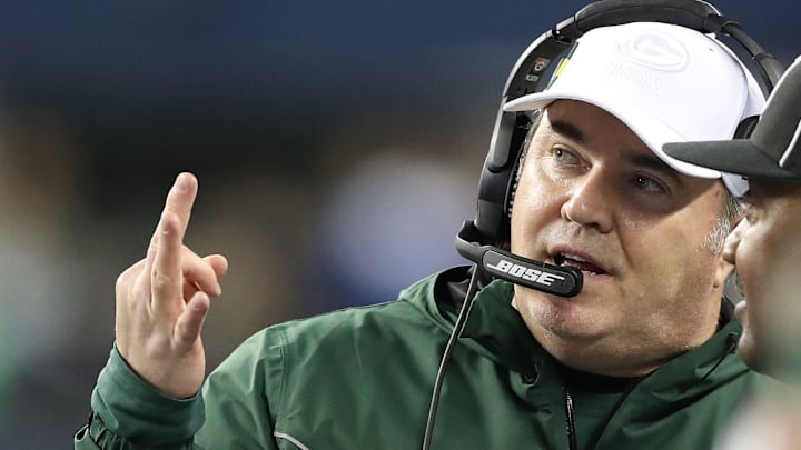 Former Green Bay Packer head coach Mike McCarthy talks with the referee against the Seattle Seahawks at CenturyLink Field Thursday, November 15, 2018 in Seattle, WA. 