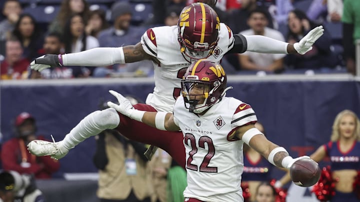Nov 20, 2022; Houston, Texas, USA; Washington Commanders safety Darrick Forrest (22) celebrates with safety Kamren Curl (31) after making an interception during the fourth quarter against the Houston Texans at NRG Stadium. 