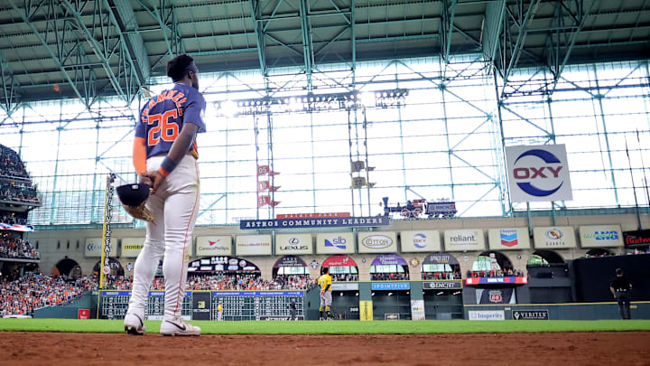 Jul 27, 2025; Houston, Texas, USA; Houston Astros center fielder Taylor Trammell (26) stands during the playing of God Bless America during the seventh inning against the Athletics at Daikin Park. 