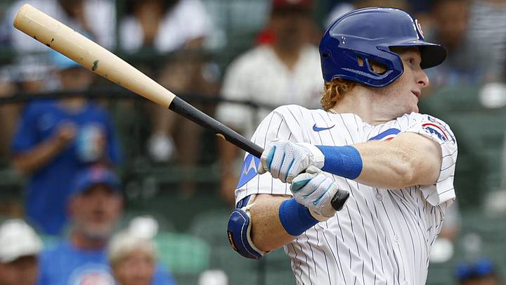 Aug 19, 2025; Chicago, Illinois, USA; Chicago Cubs right fielder Owen Caissie (19) hits a solo home run against the Milwaukee Brewers during the sixth inning of the game one of the doubleheader at Wrigley Field. Mandatory Credit: Kamil Krzaczynski-Imagn Images