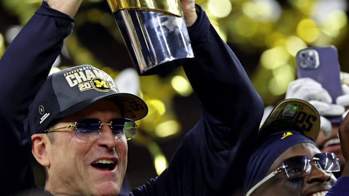 Jan 8, 2024; Houston, TX, USA; Michigan Wolverines head coach Jim Harbaugh holds the National
