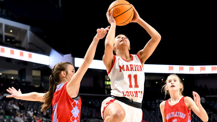 Marion County forward Leiporshia Lipsey (11) goes to the hoop against University Charter during the state semifinal game Monday, Feb. 28, 2022, at Legacy Arena in Birmingham, Alabama.

University Charter Vs Marion County Ahsaa State Semifinal