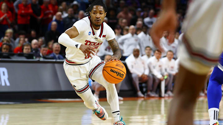 Mar 22, 2025; Wichita, KS, USA; Texas Tech Red Raiders guard Elijah Hawkins (3) dribbles the ball against the Drake Bulldogs during the first half at Intrust Bank Arena. Mandatory Credit: Nick Tre. Smith-Imagn Images