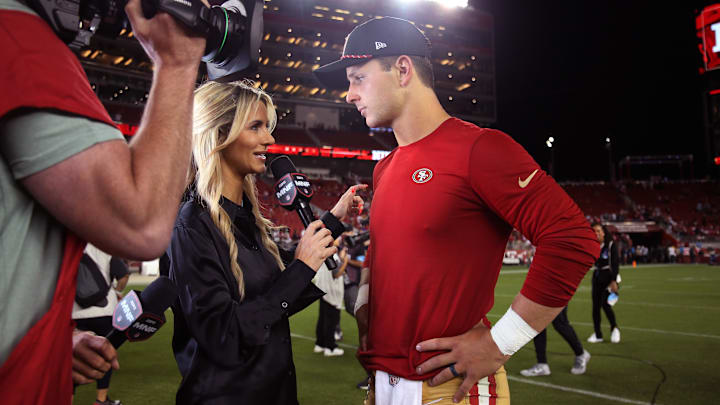 Sep 9, 2024; Santa Clara, California, USA; San Francisco 49ers quarterback Brock Purdy (13) talks with Monday Night Football's Laura Rutledge after the win against the New York Jets at Levi's Stadium. Mandatory Credit: David Gonzales-Imagn Images