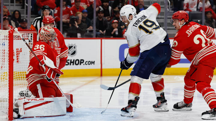 Mar 6, 2026; Detroit, Michigan, USA;  Florida Panthers left wing Matthew Tkachuk (19) scores on Detroit Red Wings goaltender John Gibson (36) in the third period at Little Caesars Arena. Mandatory Credit: Rick Osentoski-Imagn Images