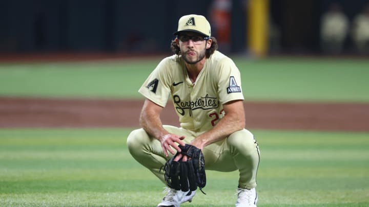 Jul 9, 2024; Phoenix, Arizona, USA; Arizona Diamondbacks pitcher Zac Gallen reacts in the second inning against the Atlanta Braves at Chase Field. Mandatory Credit: Mark J. Rebilas-USA TODAY Sports