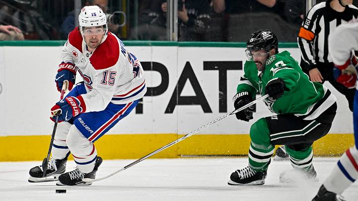 Montreal Canadiens center Alex Newhook (15) skates with the puck in front of Dallas Stars center Colin Blackwell (15) during second period at American Airlines Center. Mandatory Credit: Jerome Miron-Imagn Images