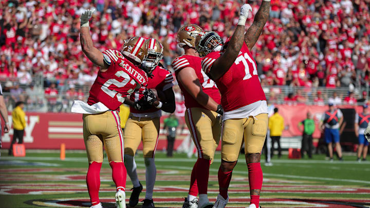 Oct 1, 2023; Santa Clara, California, USA; San Francisco 49ers running back Christian McCaffrey (23) and offensive tackle Trent Williams (71) celebrate after a touchdown during the fourth quarter against the Arizona Cardinals at Levi's Stadium. Mandatory Credit: Sergio Estrada-Imagn Images Oct 1, 2023; Santa Clara, California, USA; San Francisco 49ers running back Christian McCaffrey (23) and offensive tackle Trent Williams (71) celebrate after a touchdown during the fourth quarter against the Arizona Cardinals at Levi's Stadium. Mandatory Credit: Sergio Estrada-Imagn Images