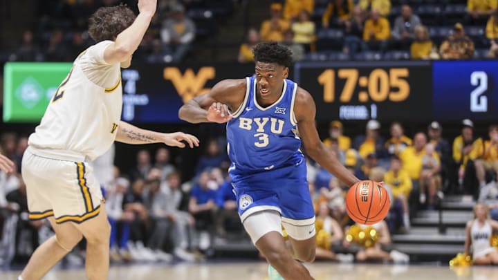 Feb 28, 2026; Morgantown, West Virginia, USA; BYU Cougars forward AJ Dybantsa (3) dribbles against West Virginia Mountaineers guard Treysen Eaglestaff (52) during the first half at Hope Coliseum. Mandatory Credit: Ben Queen-Imagn Images