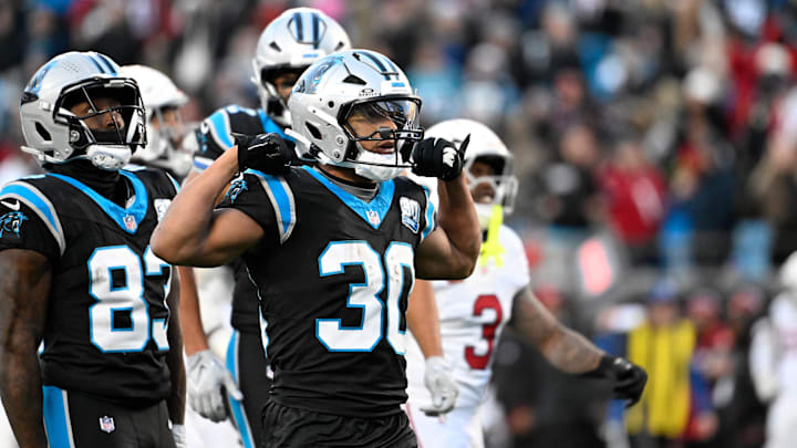 Dec 22, 2024; Charlotte, North Carolina, USA;  Carolina Panthers running back Chuba Hubbard (30) reacts after running for a first down in overtime at Bank of America Stadium. Mandatory Credit: Bob Donnan-Imagn Images