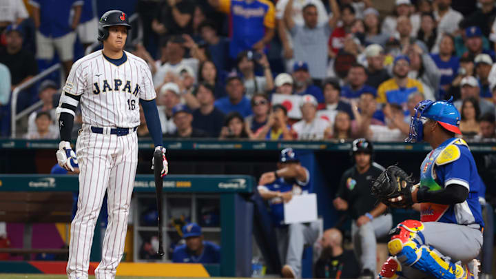 Mar 14, 2026; Miami, FL, United States; Japan designated hitter Shohei Ohtani (16) reacts toward Venezuela catcher Salvador Perez (13) in the seventh inning during a quarterfinal game of the 2026 World Baseball Classic at loanDepot Park. Mandatory Credit: Sam Navarro-Imagn Images