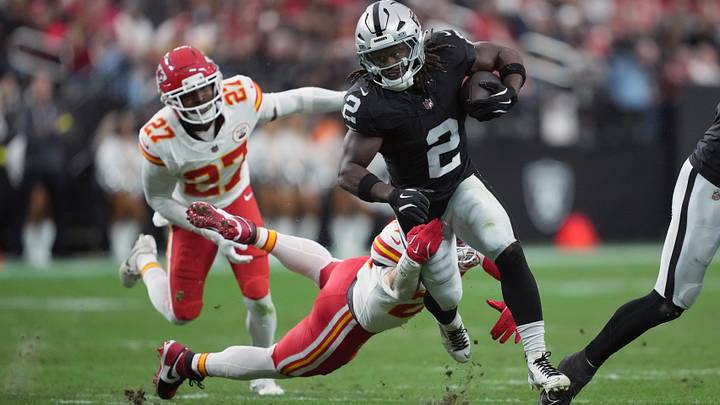 Jan 4, 2026; Paradise, Nevada, USA; Las Vegas Raiders running back Ashton Jeanty (2) carries the ball against Kansas City Chiefs linebacker Drue Tranquill (23) in the first half at Allegiant Stadium. Mandatory Credit: Kirby Lee-Imagn Images Jan 4, 2026; Paradise, Nevada, USA; Las Vegas Raiders running back Ashton Jeanty (2) carries the ball against Kansas City Chiefs linebacker Drue Tranquill (23) in the first half at Allegiant Stadium. Mandatory Credit: Kirby Lee-Imagn Images