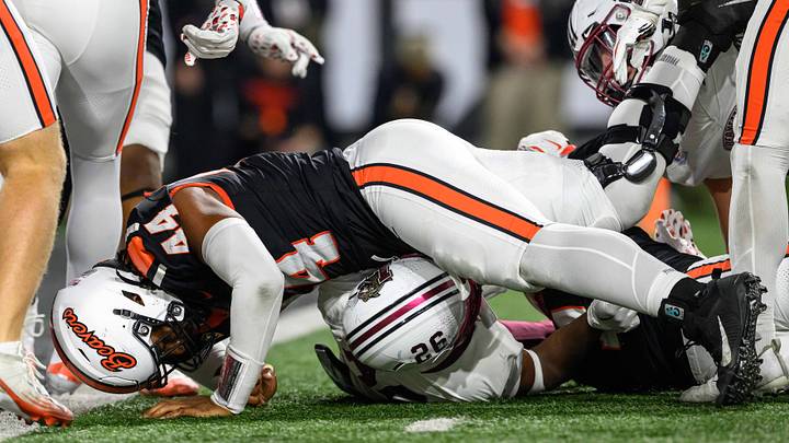 Oct 18, 2025; Corvallis, Oregon, USA; Lafayette Leopards running back Kente Edwards (26) is stopped behind the line by Oregon State Beavers defensive lineman Takari Hickle (44) during the second quarter at Reser Stadium. Mandatory Credit: Craig Strobeck-Imagn Images Oct 18, 2025; Corvallis, Oregon, USA; Lafayette Leopards running back Kente Edwards (26) is stopped behind the line by Oregon State Beavers defensive lineman Takari Hickle (44) during the second quarter at Reser Stadium. Mandatory Credit: Craig Strobeck-Imagn Images