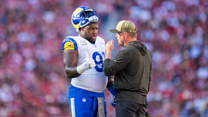 November 9, 2025; Santa Clara, California, USA; Los Angeles Rams defensive end Kobie Turner (91) and defensive line coach Giff Smith (right) during the second quarter against the San Francisco 49ers at Levi's Stadium. Mandatory Credit: Kyle Terada-Imagn Images